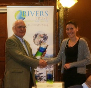 Bella receives the award from Ivor Lewelyn, Director of the Atlantic Salmon Trust